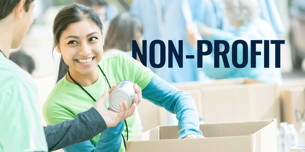 a couple of charity workers packing food tins