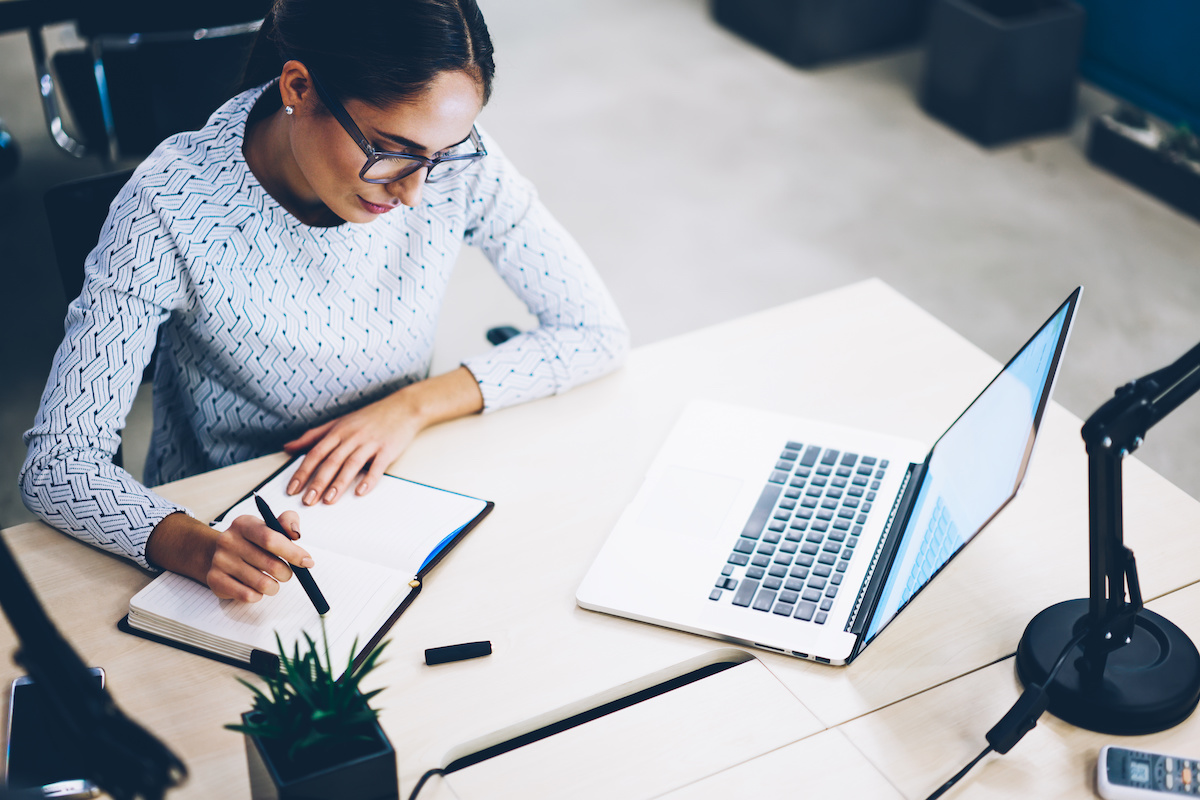 woman researching surety bonds for construction projects at her laptop