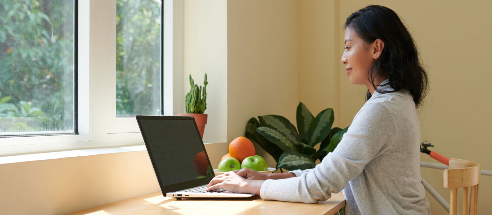 a person with good posture working at a computer.
